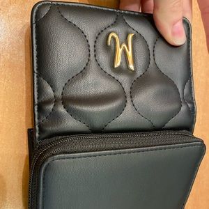 Leather looking M monogram black wallet. Lots of card holders with zipper pocket
